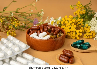 Herbal supplements for energy and focus flat lay with herbs and capsules on wooden table