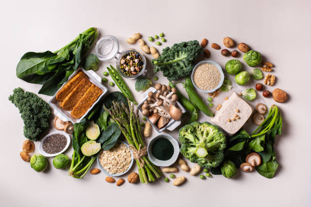 A variety of plant-based foods that form the foundation of a healthy vegan diet.